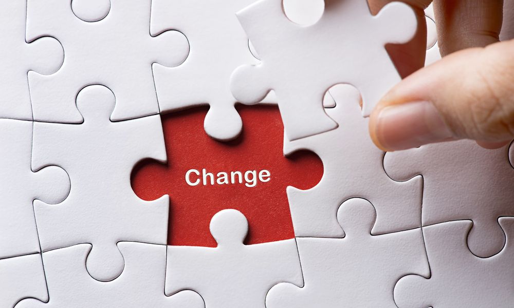 A jigsaw puzzle with the word 'change' underneath the missing piece