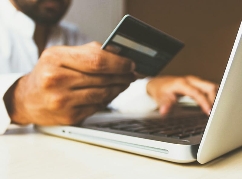Man with laptop and credit card